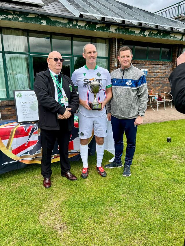 PSNI captain receiving Cup for 2025 Army Vets tournament