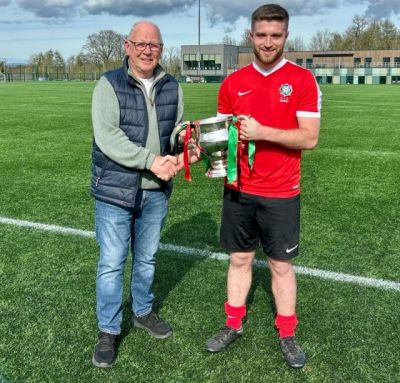 Armagh & Down - Steven Fleck receiving the McAleavey Cup from League Chairman Alan McClune