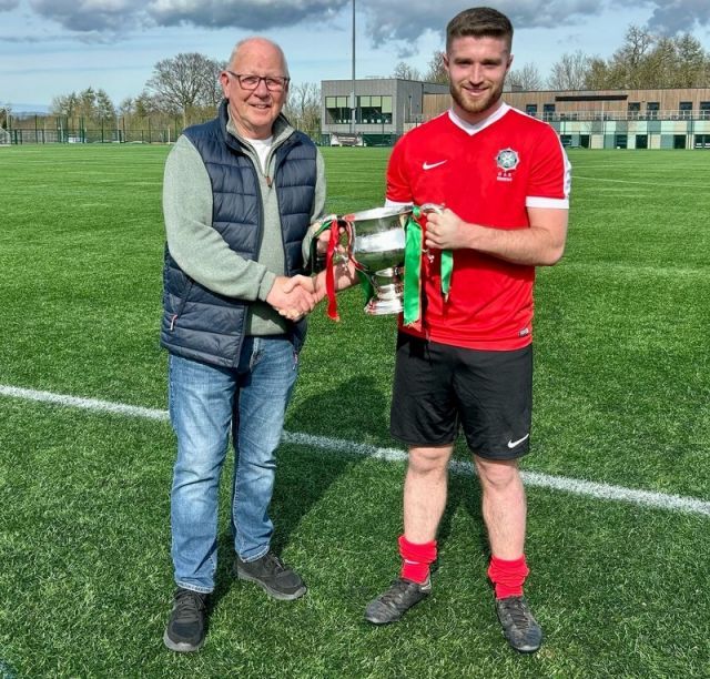 Armagh & Down - Steven Fleck receiving the McAleavey Cup from League Chairman Alan McClune
