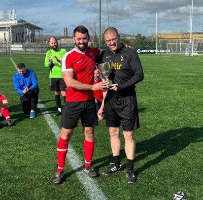 Philip Neill receiving the Buckley Cup from committee member Minty Murray