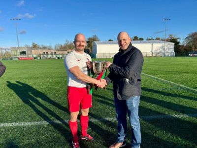 2025 - Jack Thompson on behalf of C4 receiving the McDowell Cup from League President Gary Busch