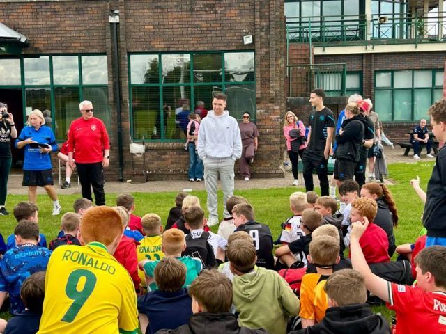 Paul Smyth {QPR & NI player} talking to the children at 2026 Soccer School