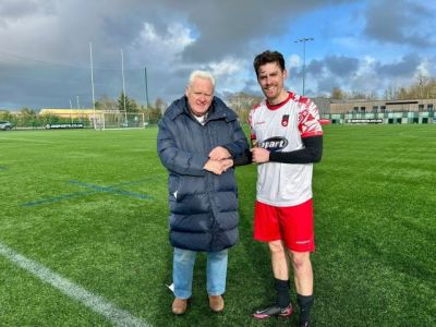 Man of the Match Anrew Ferguson receiving his 2025 Buckley trophy from League Secretary Ivan Bell