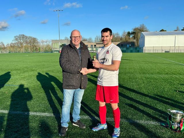 2025 - Ciaran Taylor receiving his !Man of the Match! trophy from League Chairman Alan McClune