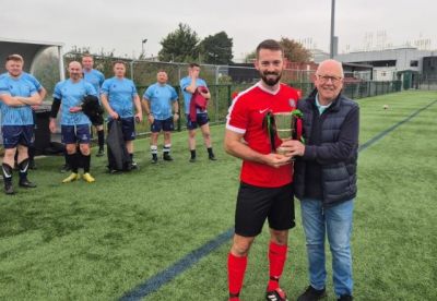 Phil Neill receiving the 2024 Buckley Cup for Armagh & Down from Legue Chairman Alan McClune