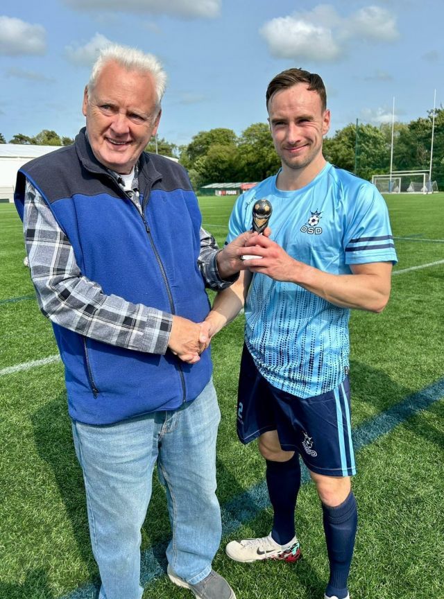 Mark Anderson receiving his 2024 McDowell Cup *Man of the Match* trophy from League Secretary