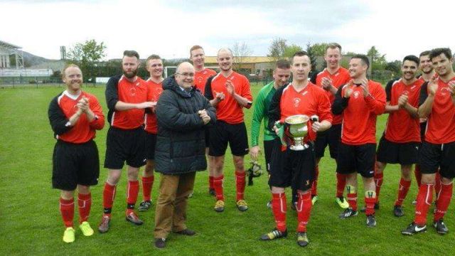 Stevie Lawson after receiving the McAleaey Cup from Police Federation CEO George Clarke