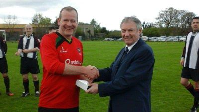 Mark Wilson receiving his Man of the Match trophy from Alan Buchanan